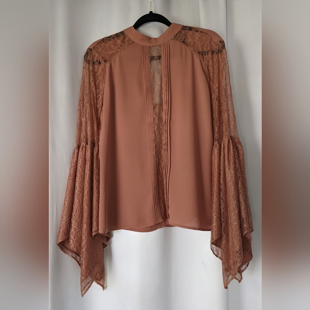 Beautiful romantic lace bell sleeve blouse.